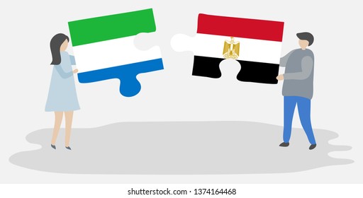 Couple holding two puzzles pieces with Sierra Leonean and Egyptian flags. Sierra Leone and Egypt national symbols together.