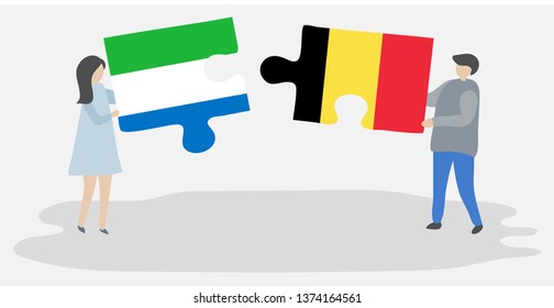 Couple holding two puzzles pieces with Sierra Leonean and Belgian flags. Sierra Leone and Belgium national symbols together.