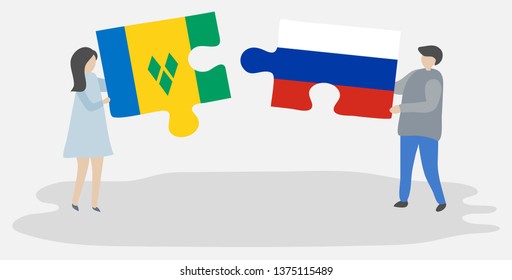 Couple holding two puzzles pieces with Vincentian and Russian flags. Saint Vincent and the Grenadines and Russia national symbols together.