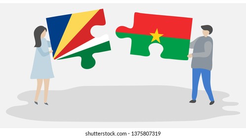 Couple holding two puzzles pieces with Seychellois and Burkinabe flags. Seychelles and Burkina Faso national symbols together.