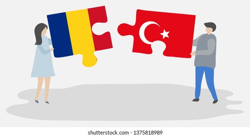 Couple holding two puzzles pieces with Romanian and Turkish flags. Romania and Turkey national symbols together.