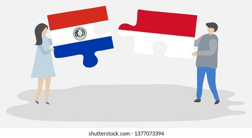 Couple holding two puzzles pieces with Paraguayan and Indonesian flags. Paraguay and Indonesia national symbols together.
