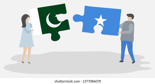 Couple holding two puzzles pieces with Pakistani and Somali flags. Pakistan and Somalia national symbols together.