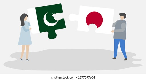 Couple holding two puzzles pieces with Pakistani and Japanese flags. Pakistan and Japan national symbols together.
