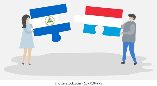 Couple holding two puzzles pieces with Nicaraguan and Luxembourgish flags. Nicaragua and Luxembourg national symbols together.