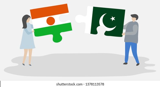 Couple holding two puzzles pieces with Nigerien and Pakistani flags. Niger and Pakistan national symbols together.