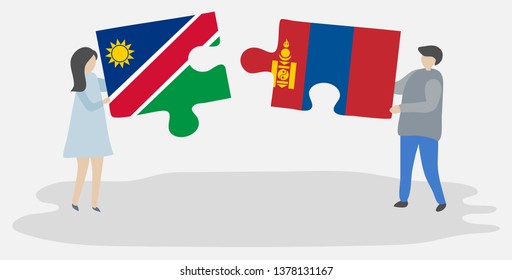 Couple holding two puzzles pieces with Namibian and Mongolian flags. Namibia and Mongolia national symbols together.