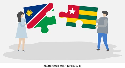 Couple holding two puzzles pieces with Namibian and Togolese flags. Namibia and Togo national symbols together.