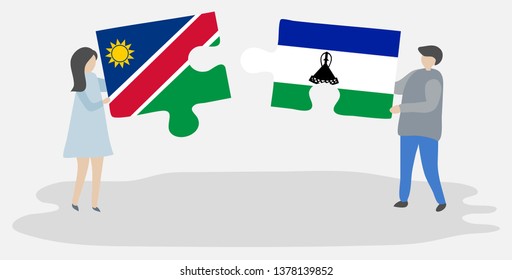 Couple holding two puzzles pieces with Namibian and Basotho flags. Namibia and Lesotho national symbols together.