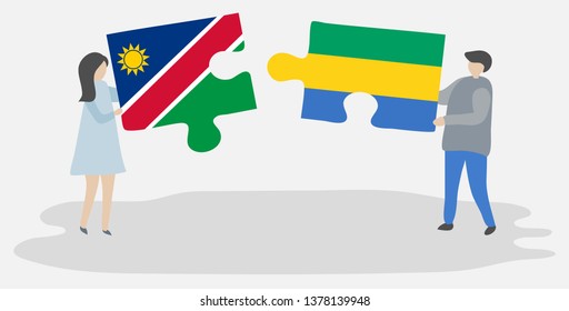 Couple holding two puzzles pieces with Namibian and Gabonese flags. Namibia and Gabon national symbols together.