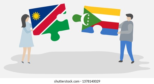 Couple holding two puzzles pieces with Namibian and Comoran flags. Namibia and Comoros national symbols together.