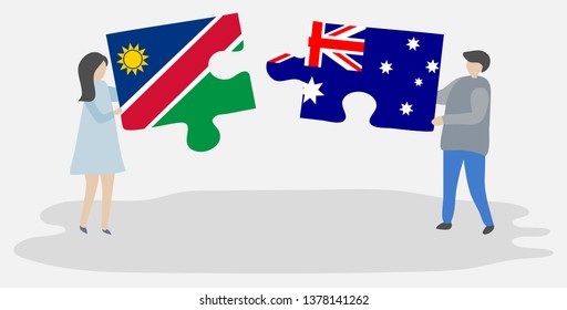Couple holding two puzzles pieces with Namibian and Australian flags. Namibia and Australia national symbols together.