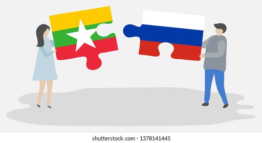 Couple holding two puzzles pieces with Burmese and Russian flags. Myanmar and Russia national symbols together.