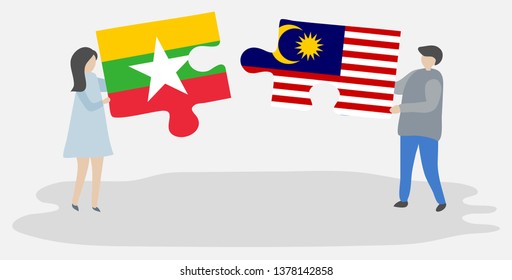 Couple holding two puzzles pieces with Burmese and Malaysian flags. Myanmar and Malaysia national symbols together.
