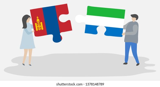 Couple holding two puzzles pieces with Mongolian and Sierra Leonean flags. Mongolia and Sierra Leone national symbols together.