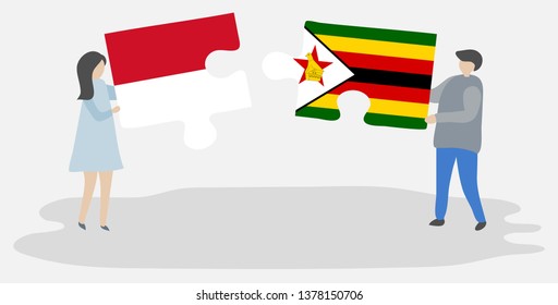 Couple holding two puzzles pieces with Monegasque and Zimbabwean flags. Monaco and Zimbabwe national symbols together.