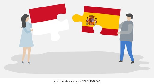 Couple holding two puzzles pieces with Monegasque and Spanish flags. Monaco and Spain national symbols together.