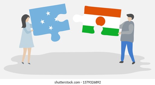 Couple holding two puzzles pieces with Micronesian and Nigerien flags. Micronesia and Niger national symbols together.