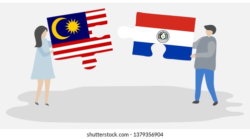 Couple holding two puzzles pieces with Malaysian and Paraguayan flags. Malaysia and Paraguay national symbols together.