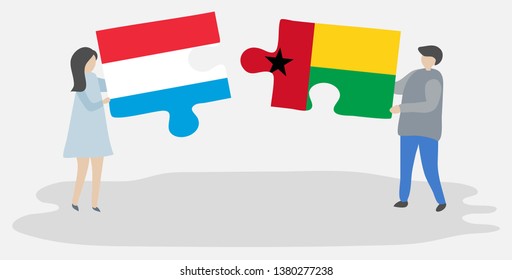 Couple holding two puzzles pieces with Luxembourgish and Bissau-Guinean flags. Luxembourg and Guinea-Bissau national symbols together.