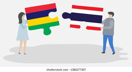 Couple holding two puzzles pieces with Mauritian and Thai flags. Mauritius and Thailand national symbols together.