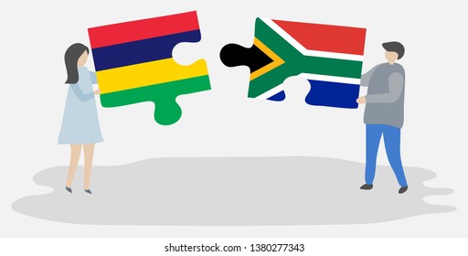 Couple holding two puzzles pieces with Mauritian and South African flags. Mauritius and South Africa national symbols together.