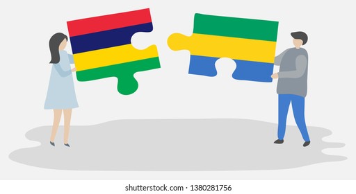 Couple holding two puzzles pieces with Mauritian and Gabonese flags. Mauritius and Gabon national symbols together.