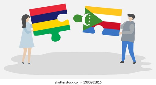 Couple holding two puzzles pieces with Mauritian and Comoran flags. Mauritius and Comoros national symbols together.