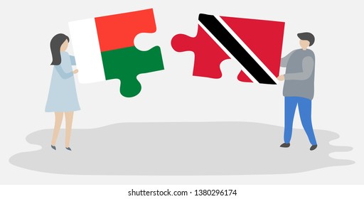 Couple holding two puzzles pieces with Malagasy and Trinidadian flags. Madagascar and Trinidad and Tobago national symbols together.