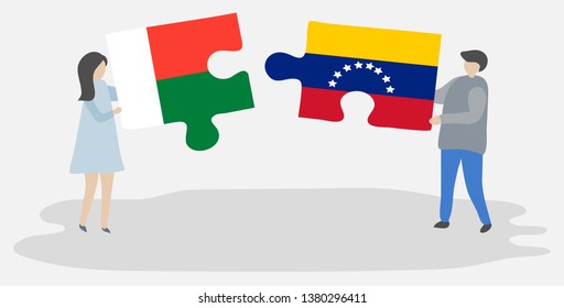 Couple holding two puzzles pieces with Malagasy and Venezuelan flags. Madagascar and Venezuela national symbols together.