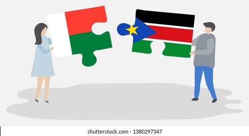 Couple holding two puzzles pieces with Malagasy and South Sudanese flags. Madagascar and South Sudan national symbols together.