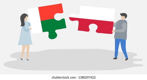 Couple holding two puzzles pieces with Malagasy and Polish flags. Madagascar and Poland national symbols together.
