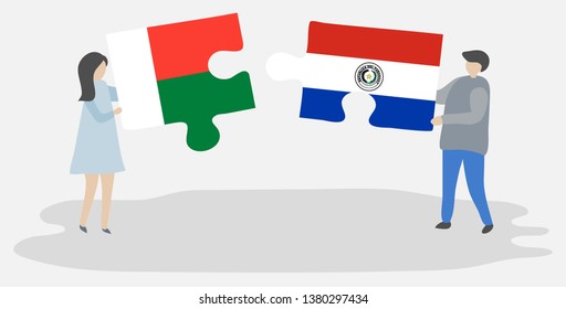 Couple holding two puzzles pieces with Malagasy and Paraguayan flags. Madagascar and Paraguay national symbols together.