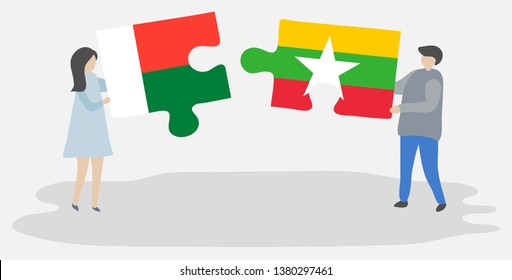 Couple holding two puzzles pieces with Malagasy and Burmese flags. Madagascar and Myanmar national symbols together.