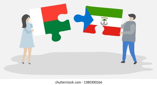 Couple holding two puzzles pieces with Malagasy and Equatorial Guinean flags. Madagascar and Equatorial Guinea national symbols together.