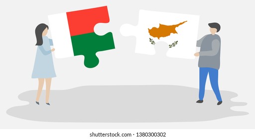 Couple holding two puzzles pieces with Malagasy and Cypriot flags. Madagascar and Cyprus national symbols together.