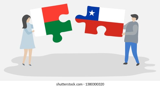 Couple holding two puzzles pieces with Malagasy and Chilean flags. Madagascar and Chile national symbols together.