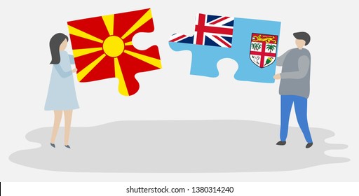 Couple holding two puzzles pieces with Macedonian and Fijian flags. Macedonia and Fiji national symbols together.