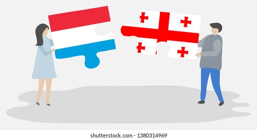 Couple holding two puzzles pieces with Luxembourgish and Georgian flags. Luxembourg and Georgia national symbols together.