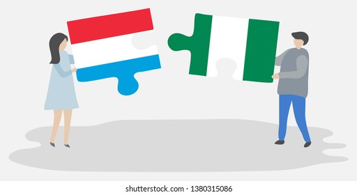 Couple holding two puzzles pieces with Luxembourgish and Nigerian flags. Luxembourg and Nigeria national symbols together.
