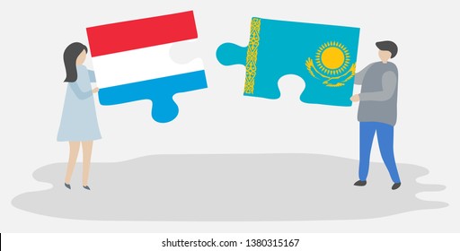 Couple holding two puzzles pieces with Luxembourgish and Kazakh flags. Luxembourg and Kazakhstan national symbols together.