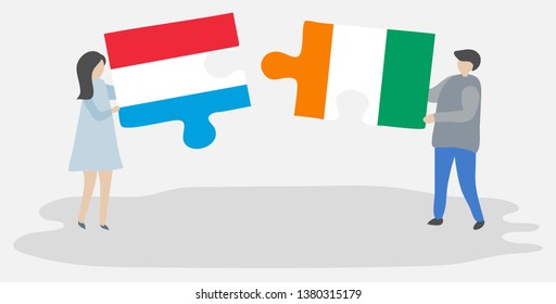 Couple holding two puzzles pieces with Luxembourgish and Ivorian flags. Luxembourg and Ivory Coast national symbols together.
