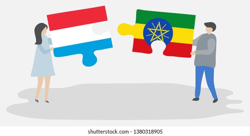 Couple holding two puzzles pieces with Luxembourgish and Ethiopian flags. Luxembourg and Ethiopia national symbols together.
