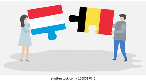 Couple holding two puzzles pieces with Luxembourgish and Belgian flags. Luxembourg and Belgium national symbols together.