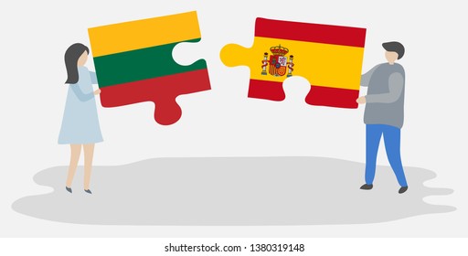 Couple holding two puzzles pieces with Lithuanian and Spanish flags. Lithuania and Spain national symbols together.