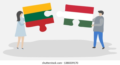 Couple holding two puzzles pieces with Lithuanian and Hungarian flags. Lithuania and Hungary national symbols together.