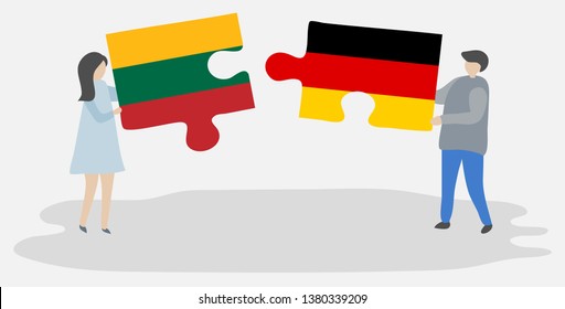Couple holding two puzzles pieces with Lithuanian and German flags. Lithuania and Germany national symbols together.