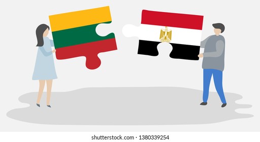 Couple holding two puzzles pieces with Lithuanian and Egyptian flags. Lithuania and Egypt national symbols together.
