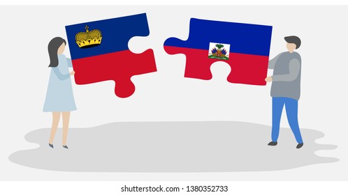 Couple holding two puzzles pieces with Liechtenstein and Haitian flags. Liechtenstein and Haiti national symbols together.