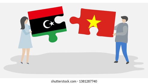 Couple holding two puzzles pieces with Libyan and Vietnamese flags. Libya and Vietnam national symbols together.